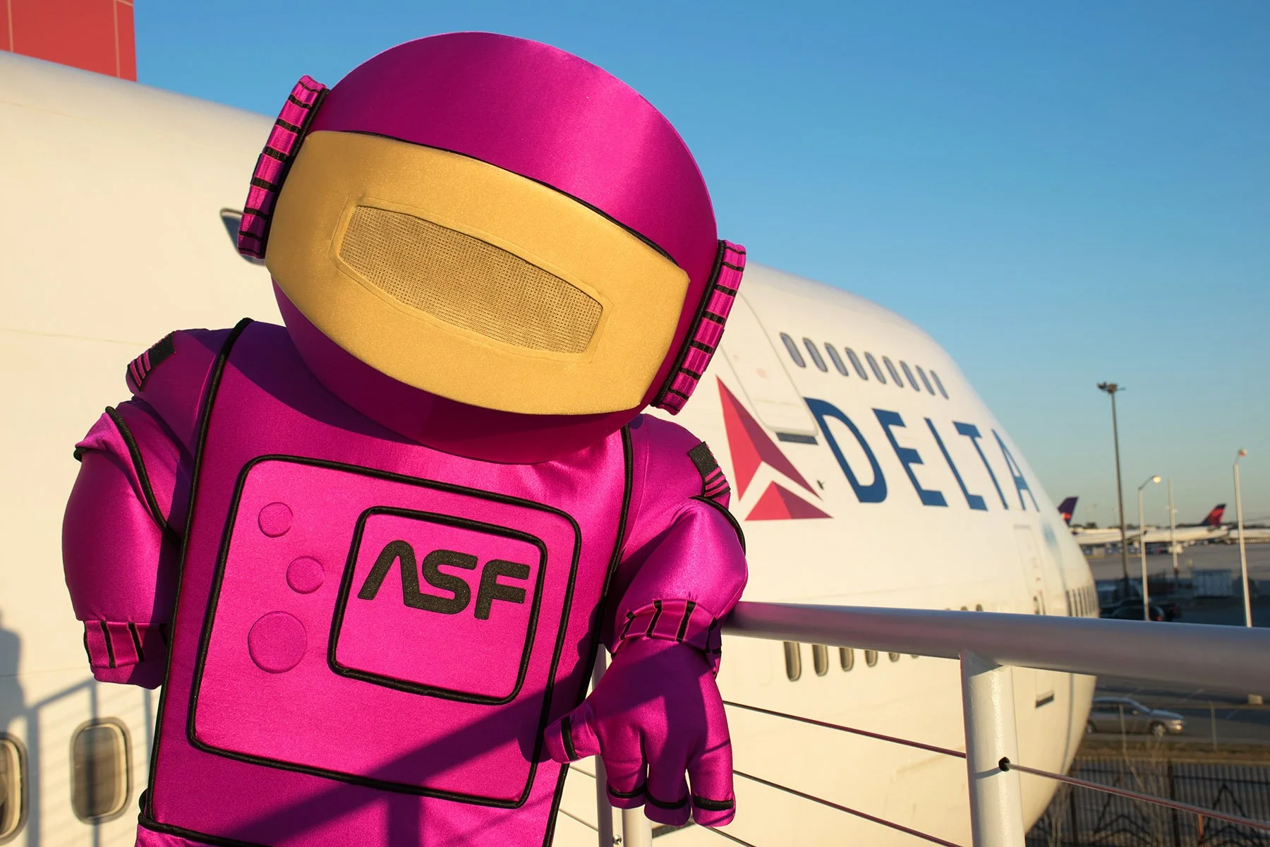 Atlanta Science Festival mascot at Delta aircraft
